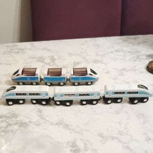 Wooden Blue and White Toy Train Set one is plastic one is wooden